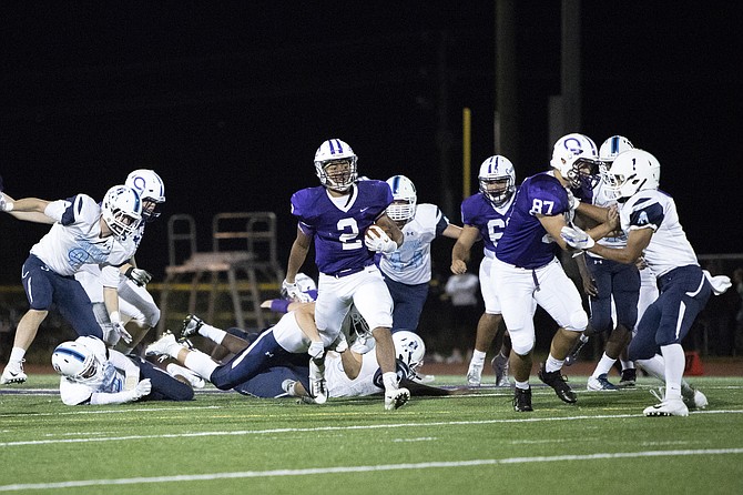 Chantilly RB Dylan Sparks #2 busts a hole through the Yorktown defensive line and makes his way downfield for a first down early in the third quarter.