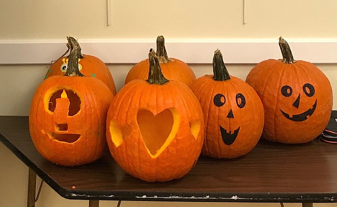 Front porch-ready Halloween pumpkins.