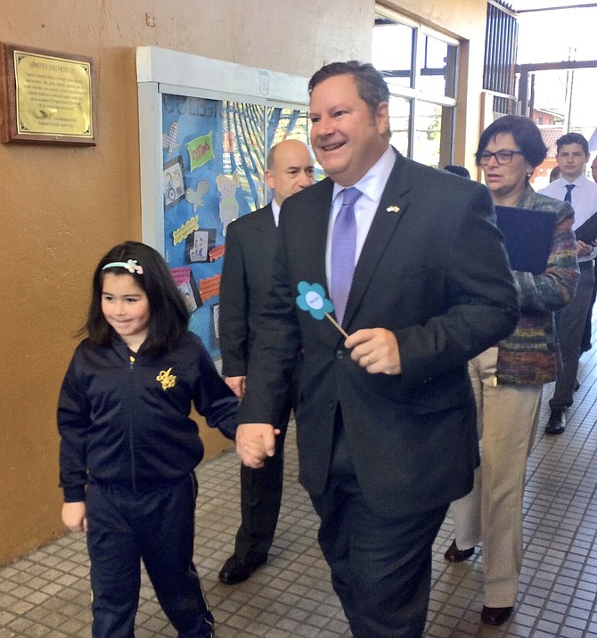 Mike Hammer with a student during one of his many school visits in Chile.