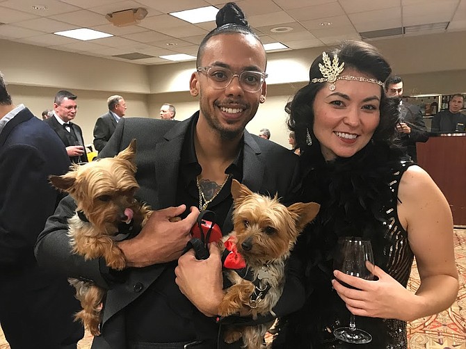 Nyke and Milo ride in the arms of Louie Sweetenberg, chatting with Cassandra Overking at the MCPAW gala at the William F. Bolger Center in Potomac. All of the dogs in attendance were beautifully turned out and brought even more joy to the occasion.