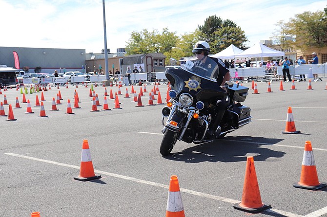 Sgt. Bobby Galpin of the Town of Herndon Police Department expertly weaves his bike through a tight course of orange cones at the 40th Annual Mid-Atlantic Police Motorcycle Rodeo. Galpin placed first in the Timed Cone Course beating out 100 other officers. 