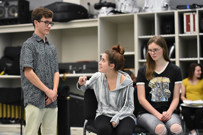 Andrew Comlish plays Markley, Lyndsey Lawrence plays Grace Fryer, and Kathleen McNerney plays Mrs. Fryer in Bishop Ireton’s “Radium Girls.”