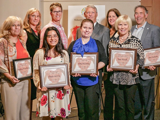 Honorees and sponsors gather for a photo at the Volunteer Alexandria Heart of Alexandria Awards Oct. 10 at the U.S. Patent and Trademark Office. In front are honorees Marjorie Windelberg, Odalis del Cid Reyes, Halley Johnson (for Celia Boertlein) and Jane Powell. In back are Volunteer Alexandria executive director Marion Brunken, sponsor Sue Kovalsky of The Jen Walker Team, Volunteer Alexandria board member Allen Lomax, Mayor Allison Silberberg and honoree Jim Durham.