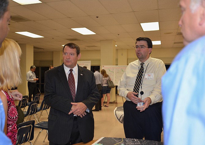 Supervisor Pat Herrity (R-Springfield) and Thomas Burke, FCDOT’s Project Manager for the Fairfax County and Franconia-Springfield Parkways study, talk with meeting attendees after Burke’s presentation at Sangster Elementary in Springfield on Oct. 11.