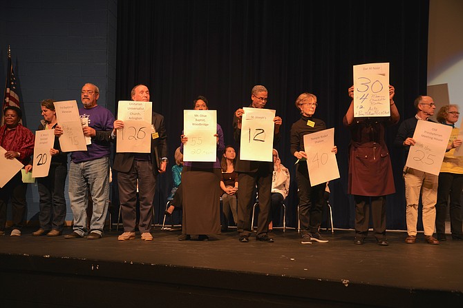 VOICE members take to the stage at the 2018 summit with pledge posters, showing how many of their group had signed up to help Get Out the Vote and to attend the next Legislative session in Richmond. “We will have at least 10 people per day calling for action in Richmond,” said VOICE leadership, who also noted that the the GOTV goal of 450 volunteers had already been exceeded by 150 persons.
