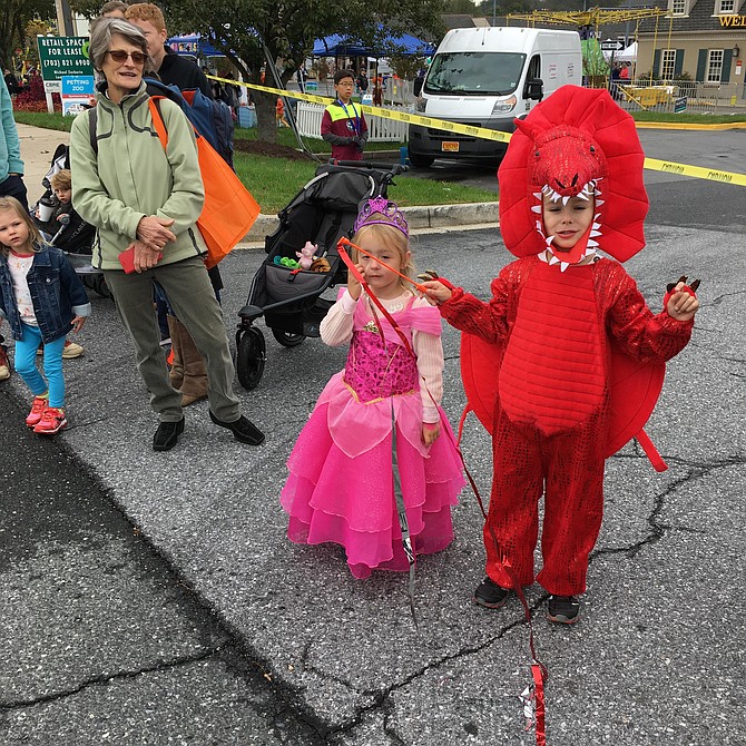 Princess Amelia and Dragon Lukas dressed in costume to watch the Potomac Day Parade on Saturday.