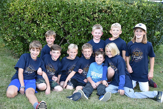 Michael Erlandson and his friends wear Light the Night T-shirts in preparation for the Light the Night Walk, which took place in Washington, D.C. last weekend. Front from left: Griffin Melley, Max Melzer, Kyle Kasprzyk, Nik Ciovacco, Michael Erlandson, and Bowen Mayo; second row: Gabriel Erlandson, Cam Olsen, Brendan Forti, and Abby Beddis.