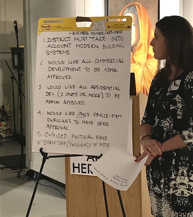 Paige Weiss Pollard, Principal Commonwealth Preservation Group, writes comments on a flip chart during the meeting with district business owners in Herndon's Heritage Preservation District on Friday, Oct. 19, 2018. Together they begin to draft the town's new Heritage Preservation District Design Guidelines. 