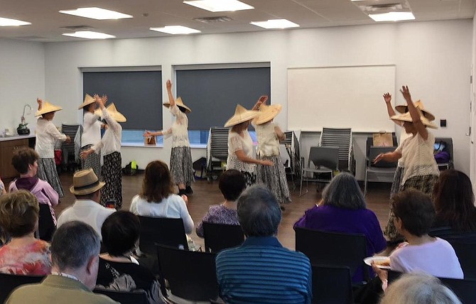 Corazon Foley performing with members of the Burke Springfield Senior Center Without Walls.