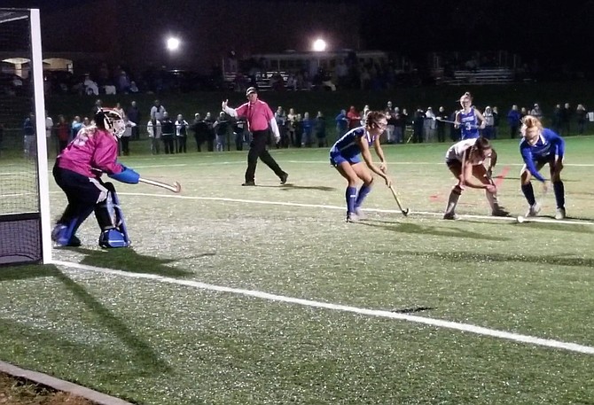 Freshman goalkeeper Jillian Ward, left, and the West Potomac field hockey team shut out top seed T.C. Williams during the Gunston District championship game on Oct. 18.