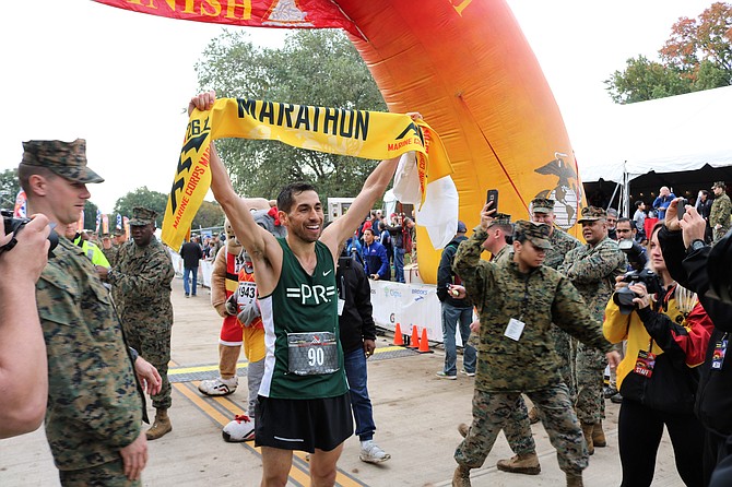 D.C. resident Jeffrey Stein, 32, celebrates after winning the 2018 Marine Corps Marathon Oct. 28 in Arlington. Stein finished the 26.2-mile course in 2:22:49.