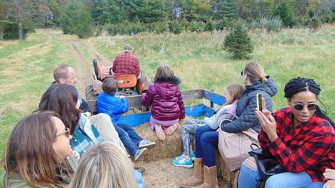 Larry Krop, owner of Krop’s Crops, leads the hayride through his 22-acre property in Great Falls.