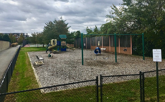 "Tot lot" playground area and tennis courts owned by Old Town Greens Homeowners' Association.