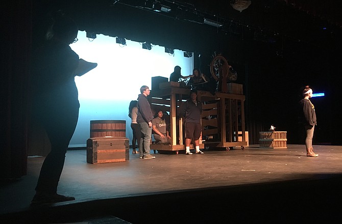 Oakton senior and student-director Emma Shacochis waits in the wings as she narrates and watches senior Rachel Bloom and the rest of the cast rehearse.