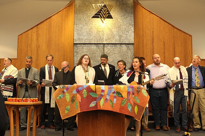 Visiting interfaith partners and community leaders stand in unity with Rabbi Michael Holzman and the congregation of Northern Virginia Hebrew Congregation during the first Shabbat after the Pittsburgh shooting when a gunman opened fire leaving 11 dead and six injured.