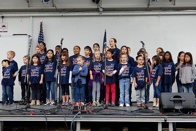 The Fairfax Choral Society Youth Choir sings the National Anthem during Centreville Day’s opening ceremonies.