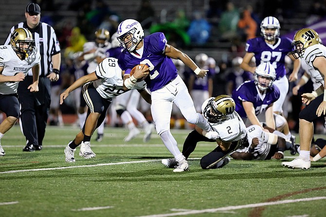 Chantilly's Dylan Sparks #2 tries to fight through the tackle of Westfield's Taylor Morin #2.