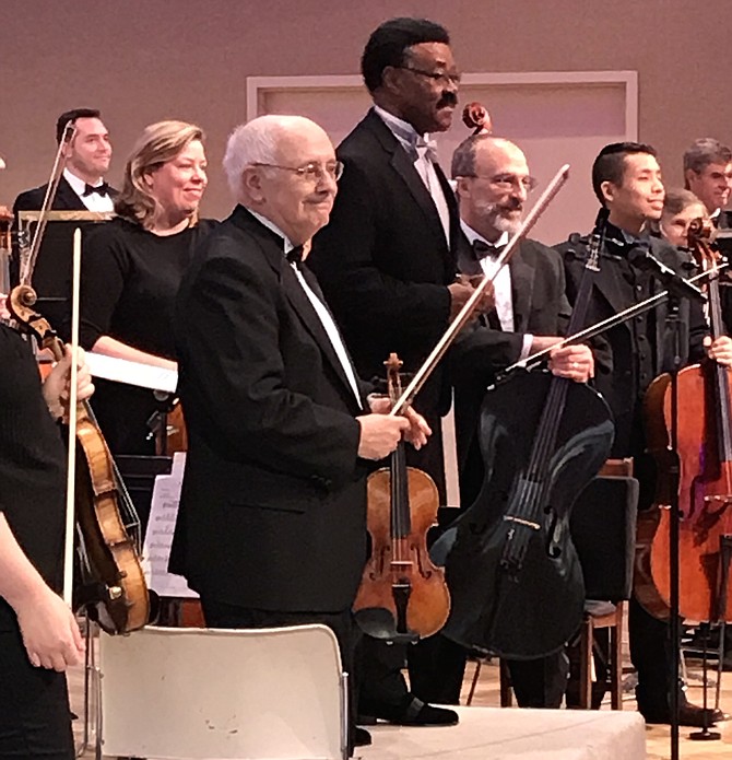 Fifty talented instrumentalists from Fairfax County and beyond, members of the Reston Community Orchestra stand during their well-deserved applause at the opening performance of its 2018-2019 season held Saturday, Nov. 3 at Reston Community Center- Hunters Woods Village Center, Reston.
