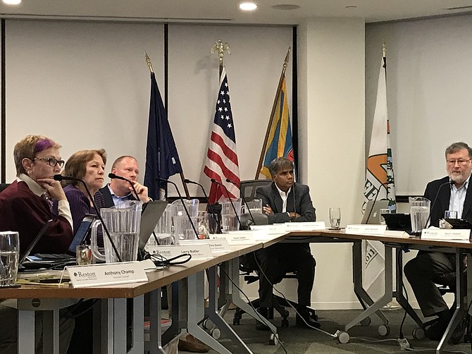 Reston Association Board of Directors listen to a member’s comments during the Thursday, Nov. 8, 2018, Special Meeting-Public Hearing.