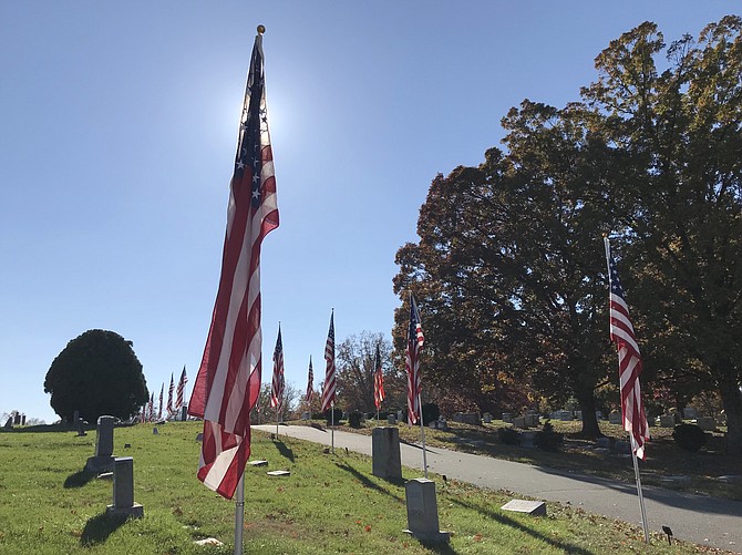 On Veterans Day 2018, casket flags fly in the breeze at Chestnut Grove Cemetery in Herndon.  The American Legion Wayne M. Kidwell Post #184 Herndon//Reston raises more than 100 casket flags every Veterans Day and Memorial Day in honor of fallen Herndon veterans.