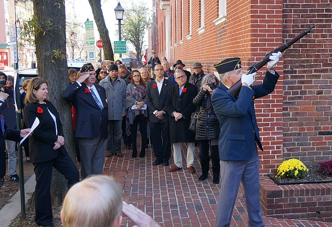 American Legion Post 24 officer Mike Mixon fires a salute during the Armistice commemoration ceremony Nov. 11 at Post 24 in Old Town.