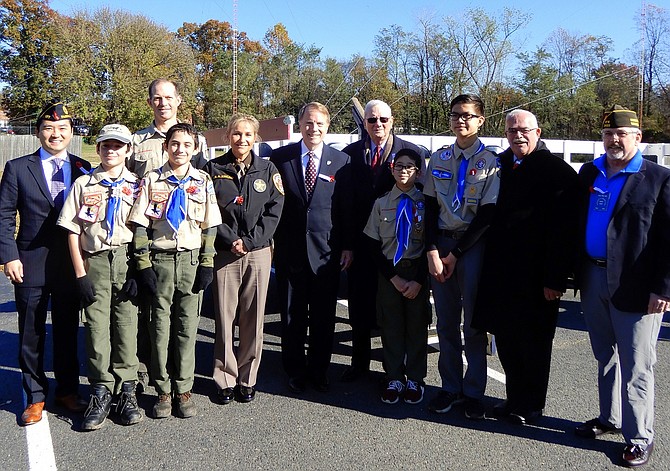 Participants gather for a group photo after Sunday’s Veterans Day ceremony at American Legion Post 177.