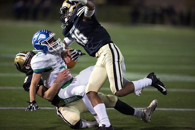 Nicholas Napolitano is brought down by Westfield's Aron Dishun #9 and Tahj Sumey #36.