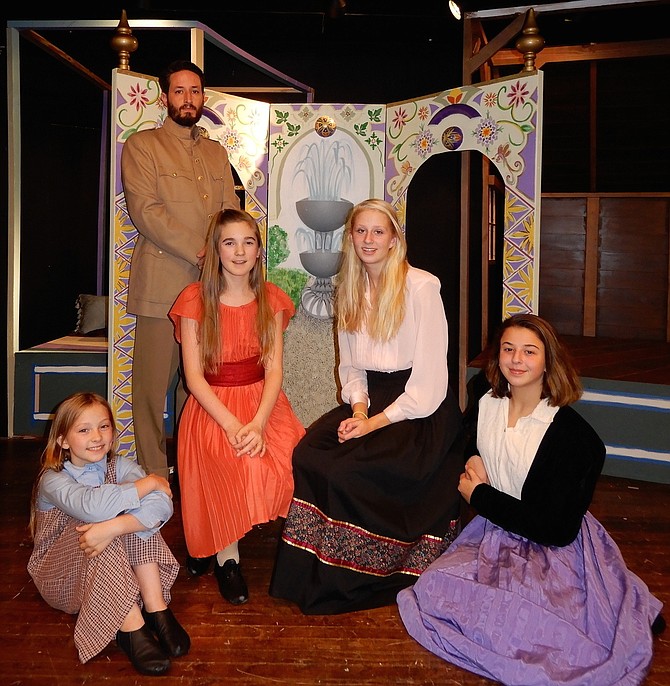 Rehearsing a scene from City of Fairfax Theatre Co.’s “The Little Princess” are: (in back) Brandon Moon and (seated, from left) Gigi Moon, Alyssa Kiffer, Martha Zimmerman and Sydney Krug.