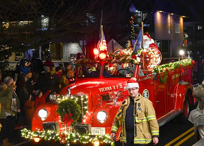 Santa rides on a 1946 Vienna fire truck.