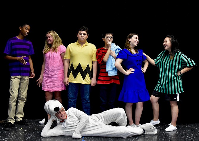 Dressed as characters from “Peanuts” are (standing, from left) Jalin Dew, Anna Moritz, Alan Gutierrez-Urista, Paul Lee, Lauren LeVine and Faith Cho, with Harry Schlatter (on floor) as Snoopy.