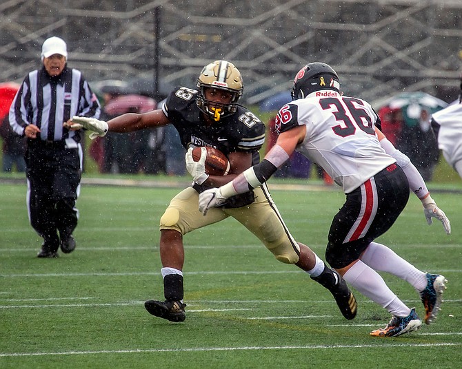 Westfield’s Maximus Wysocki #36 looks to bring down Isaiah Daniel #23.