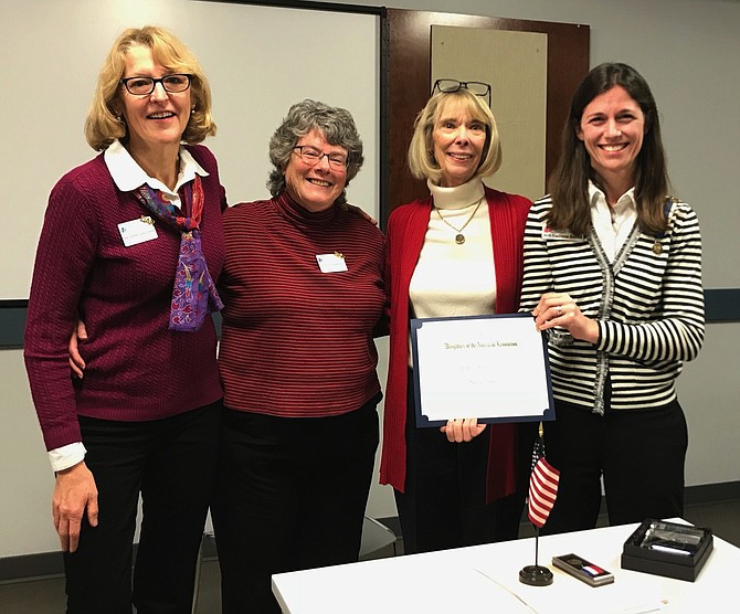 Chapter members presenting Sandra Grimes with the Women in History Award, from left: chapter member Jean Luning-Johnson, Chapter Historian Maureen Jenkins, Sandra Grimes, and Chapter Regent Beth Boswell.