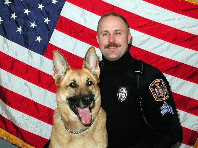 Carl Pardiny as a young K-9 officer with his dog, Doni.