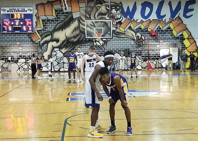 West Potomac guard Daryl Mackey Jr., left, and Lake Braddock guard Quentin James combined to score 79 points during West Potomac’s 94-84 victory on Monday.