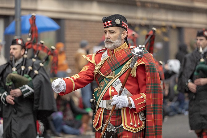 Drum Major Konstantin Gojnycz leads the City of Alexandria Pipes and Drums in the 48th annual Scottish Christmas Walk Parade Dec. 1 in Old Town. The parade is part of the Scottish Walk Weekend of events benefitting the Campagna Center.