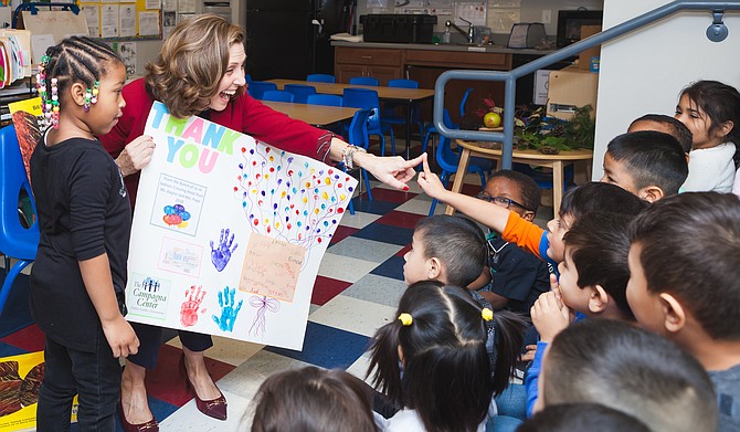 Virginia’s First Lady Pamela Northam speaks with children at a preschool program adminstered by the Campagna Center.