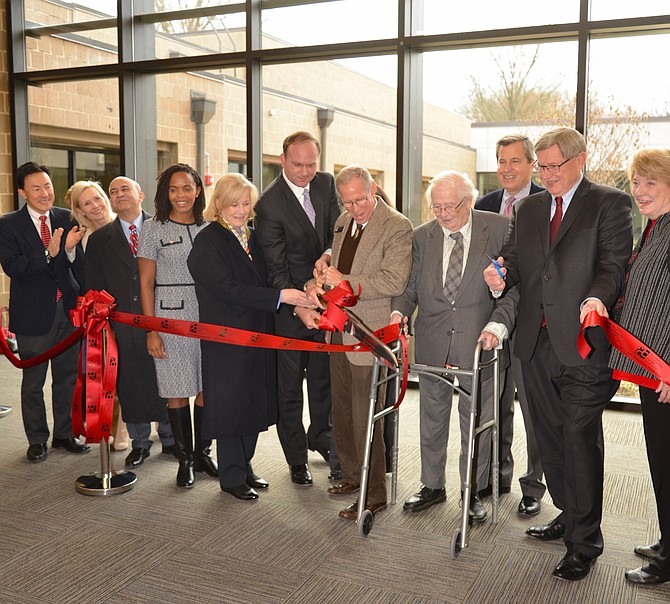 A host of area elected and civic leaders cut the ribbon to celebrate the near completion of the McLean Community Center’s renovation. George Sachs, the Center’s executive director handles the scissors with help from Del. Kathleen Murphy and MCC Governing Board Chair Paul Kohlenberger to the left, and Robert Alden, a founder of the original center to the right. Dranesville District Supervisor John Foust stands ready with an extra pair of scissors “just in case!” with state Sen. Janet Howell beside him. Del. Mark Keam and Del. Rip Sullivan also joined the official opening team.