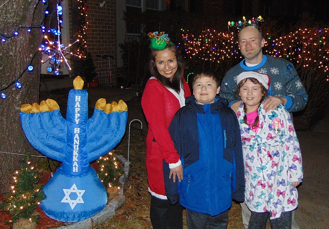 The Schwartz family of New Lakepointe in Burke: mom Maria, dad Elliott, Ethan, 11, and Ellie, 9, with their outdoor decorations.