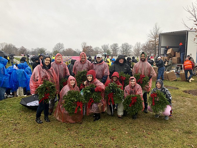 DMI employees honor fallen soldiers at Wreaths Across America.