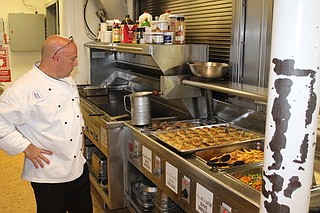 TPC Potomac’s Executive Chef David cooks for the sailors on the submarine USS Chicago, where his son Andrew is assigned.