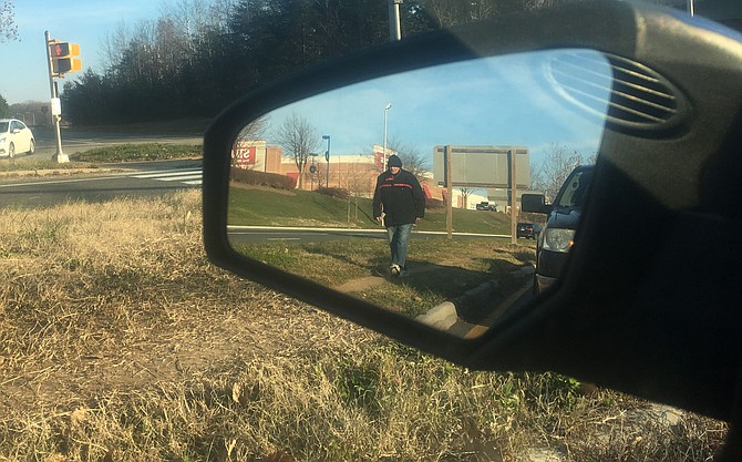 In the rearview mirror, a common sight at traffic signals in Springfield.