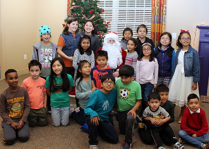 Santa visits the Arlington Housing Corporation (AHC) Afterschool program Dec. 18.