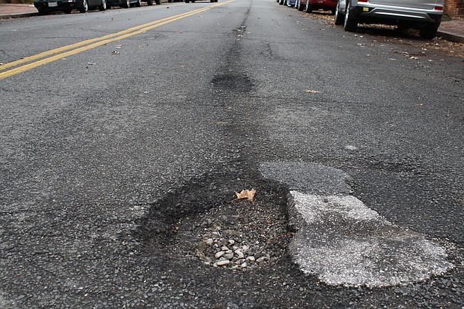 Potholes like this one on Duke Street can wreak havoc on the car.