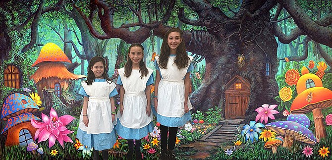 Bravo Productions presents “Alice in Wonderland, Jr.” on Saturday, Jan. 19 and Sunday, Jan. 20, 2019 at the Randolph Road Theater, 4010 Randolph Road, Silver Spring. From left are Bravo students: Small Alice (Ayla Gerstenblith from the Charles E. Smith Jewish Day School), Alice (Monica Conroy from Westbrook Elementary School), and Tall Alice (Jordan Block from North Bethesda Middle School).