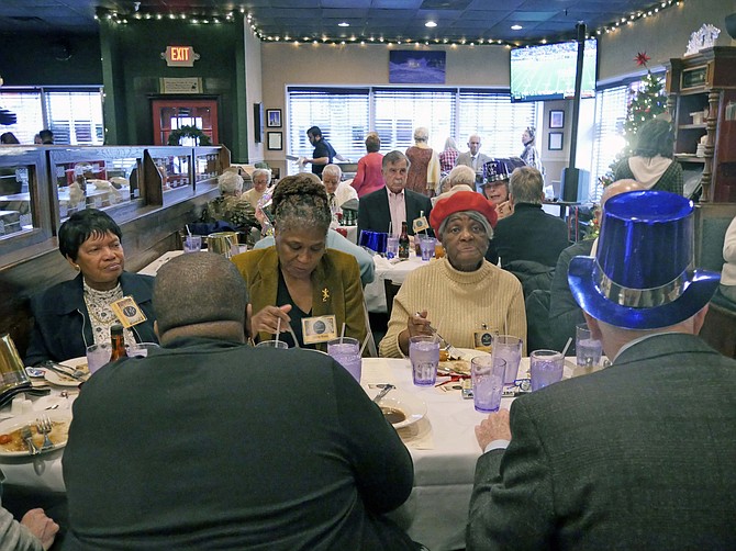 A crowd of 70 attendees has braved the rain to attend the New Year's celebration on Dec. 31 and enjoy the Irish buffet, music, entertainment and champagne toast.