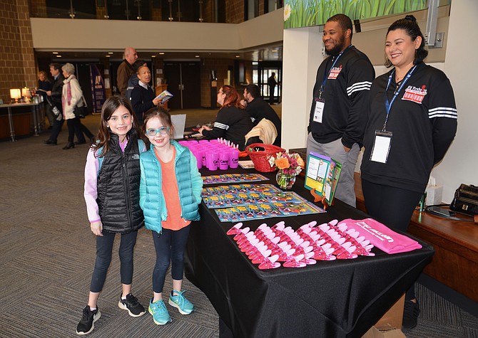 Kendyl and Katelyn, sisters from Falls Church, are ready to start their tour of the newly renovated McLean Community Center at the facility’s Open House on Jan. 5.