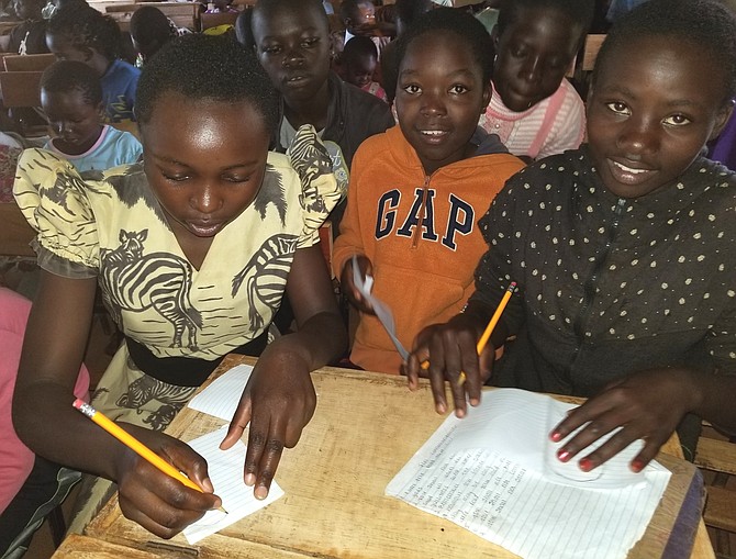 Children learning the Ten Commandments at the Children’s Conference, held at the Mutua Secondary School, Mutua, Kenya.