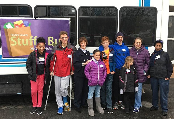 Sharon Bulova at “Stuff the Bus” event on Saturday, Jan. 19, with volunteers who collected food donations at the Giant at Fox Mill shopping center in Herndon.