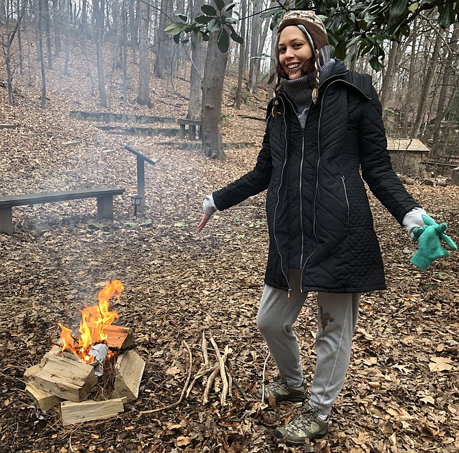 Jessica Althaus and her first fire during a workshop at the Gulf Branch Nature Center and Park.