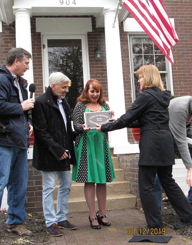 Kimra Traynor accepts the Town of Herndon Historic Structure Plaque #24 from Nancy Saunders, HHS President as Tim Bonnett and Scott Tilton look on.